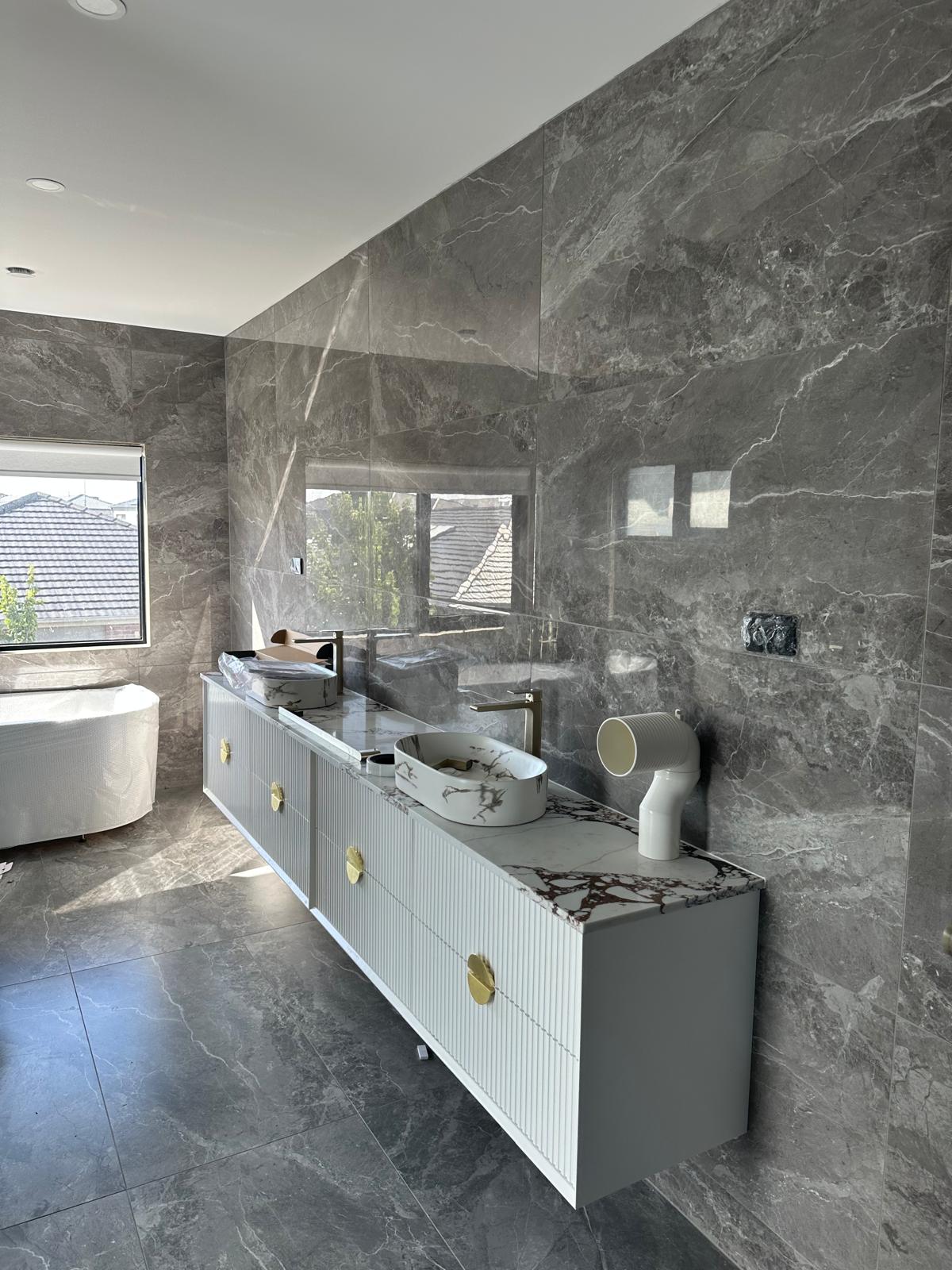 Designer vanity with marble top and brass accents